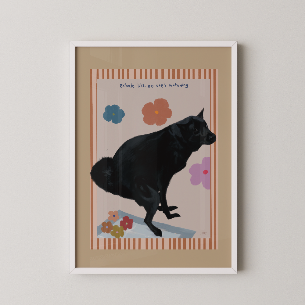 Unframed pink art print of a black dog doing his business displayed in a white frame