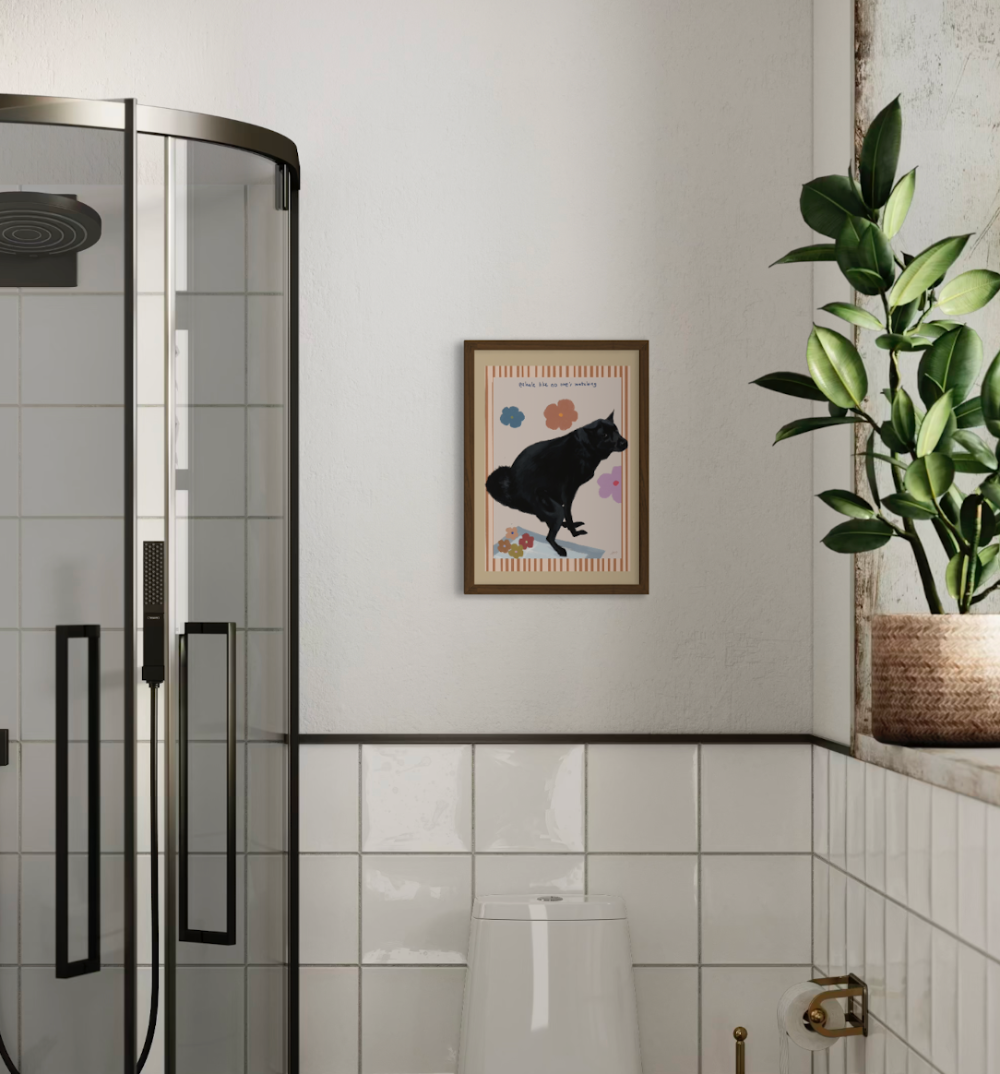 Funny black dog art print hanged in a bathroom