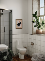 Funny black dog art print hanged on a wall in a bathroom