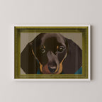 Unframed sausage dog art print displayed in a white frame