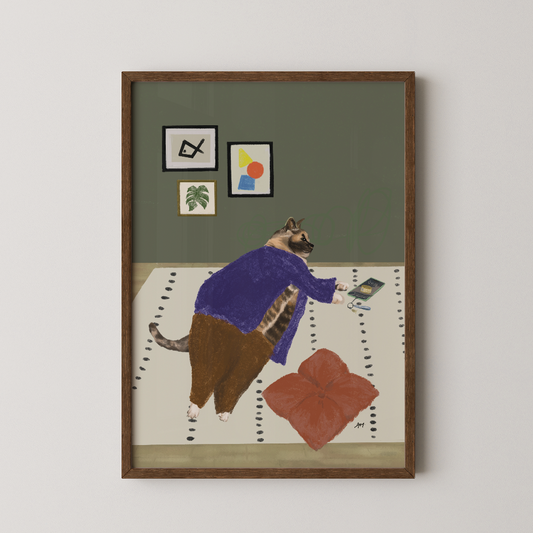 Artwork of a lazy cat in a purple sweater on a white surface with a red flower cushion