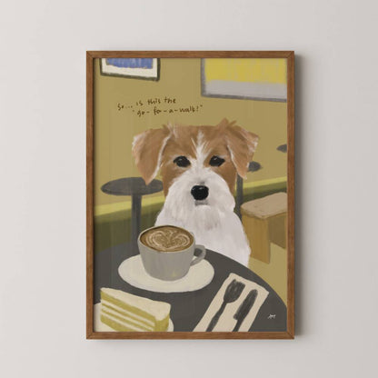 Framed artwork of a dog with a cup of coffee and cake on a table.